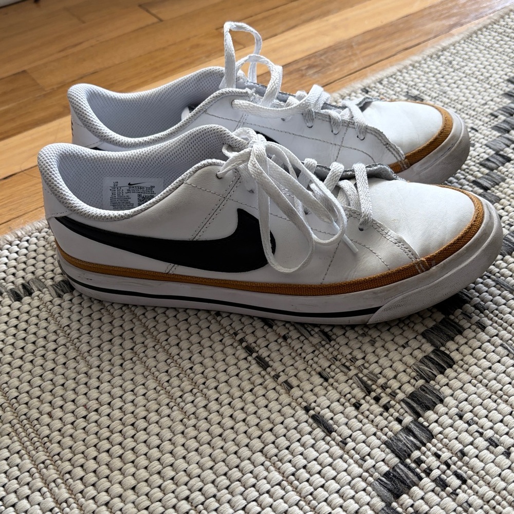 Nike White Low-Top Sneakers with Black Swoosh and Tan Trim